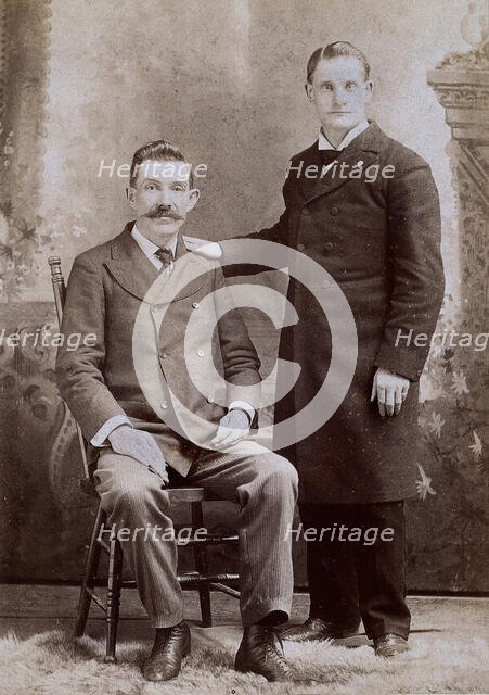 Reverend Eavens, a man with a hole in his chest, seated; with Reverend Kipe, standing, c1880s. Creator: WC Bell.