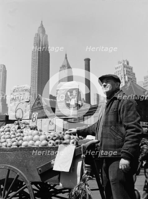 Push cart fruit vendor at the Fulton fish market, New York, 1943. Creator: Gordon Parks.