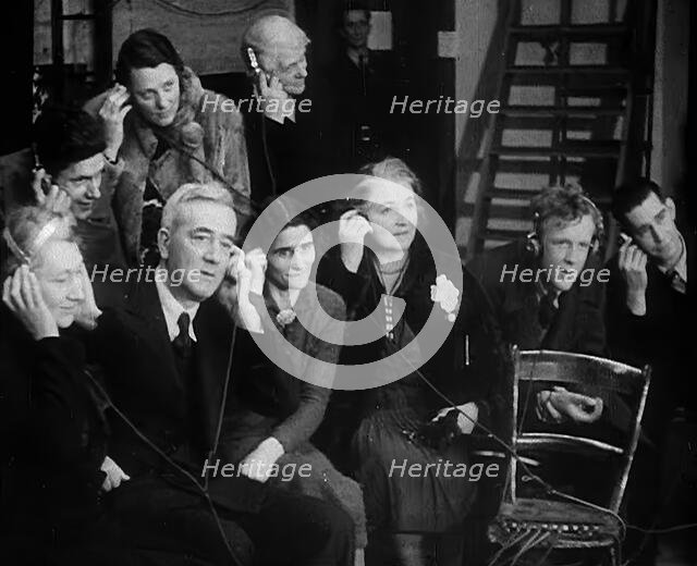 People Listening to Parents Calling Evacuee Children in America Over the Radio, 1940. Creator: British Pathe Ltd.