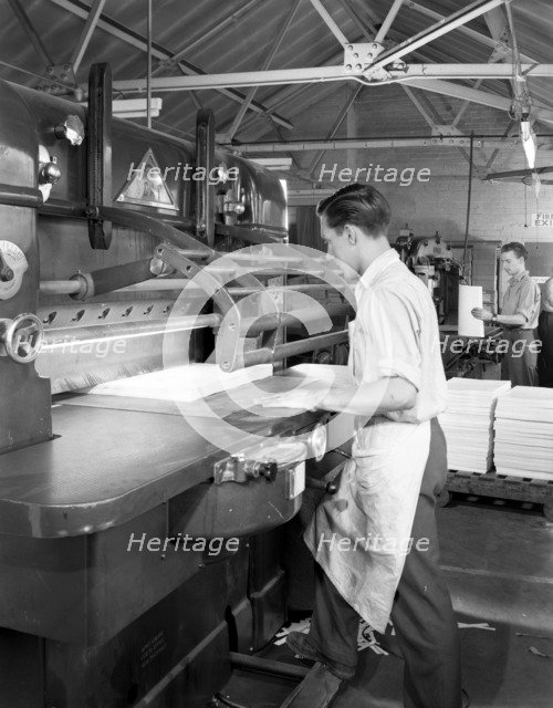 Page cutting guillotine in use at a South Yorkshire printing company, 1959.  Artist: Michael Walters