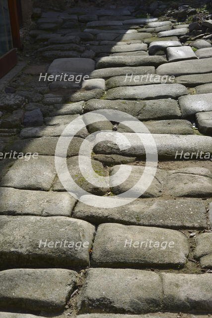 Remains of a Roman road next to the Valmardon Gate, paved with granite slabs, Toledo, Spain, 2022.  Creator: LTL.