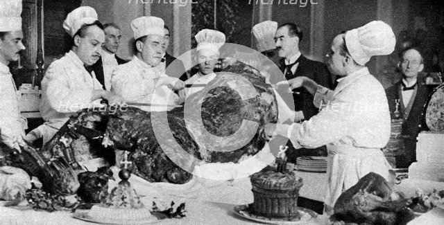 Carving a side of beef at the annual banquet at the Guildhall, London, 1926-1927. Artist: Unknown