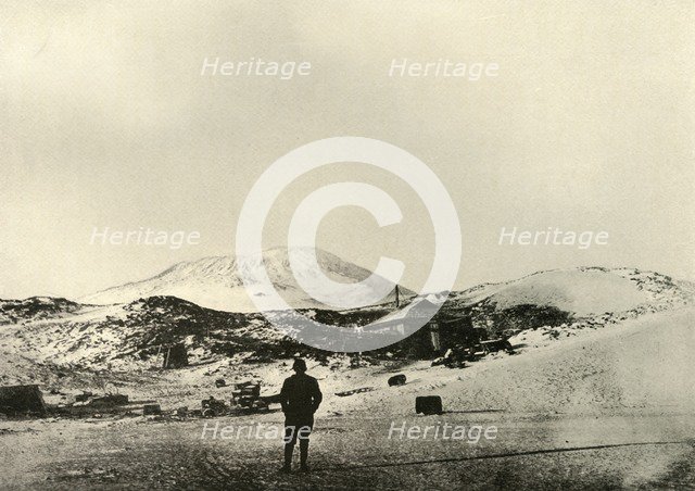 'The Hut, with Mount Erebus in the Background, in the Autumn', 1908, (1909).  Artist: Unknown.