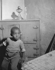A young boy who lives near the nation's capitol, Washington, D.C., 1942. Creator: Gordon Parks.