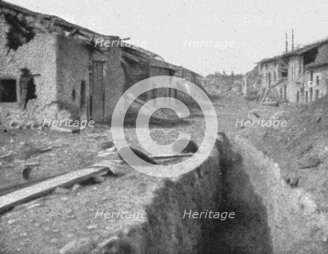 'Le Champ de Bataille; Une vue de Cumieres au debut de mai, pendant l'effort..., 1916 (1924) Creator: Unknown.