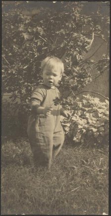 Portrait of a Child in Garden, 1907-1924. Creator: Louis Fleckenstein.