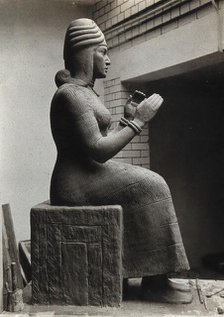 A sculpture of Gula, Mesopotamian deity of healing, with a dog at her side, c1900. Creator: Unknown.