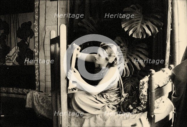 Lydia Delectorskaya preparing a canvas in Matisse’s studio, Place Charles-Félix, Nice, 1936. Creator: Matisse, Henri (1869-1954).