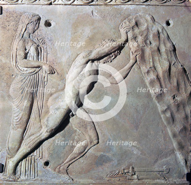 Roman terracotta Campana plaque showing Theseus lifting a huge rock. Artist: Unknown