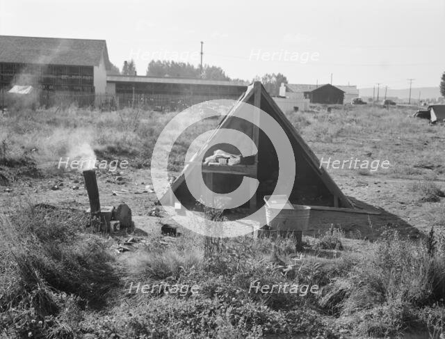 One of the forty potato camps in open field, entering town, Malin, Klamath County, Oregon, 1939. Creator: Dorothea Lange.