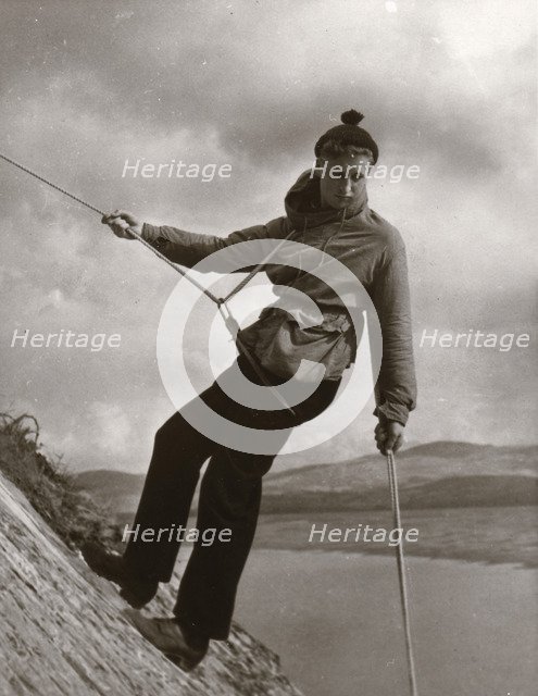 Boy descending rock face, Outward Bound School, Eskdale, Cumbria,1950. Artist: Unknown