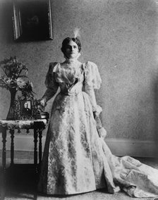 Ida S. McKinley, full-length portrait, standing, facing front, between 1890(?) and 1900(?). Creator: Frances Benjamin Johnston.