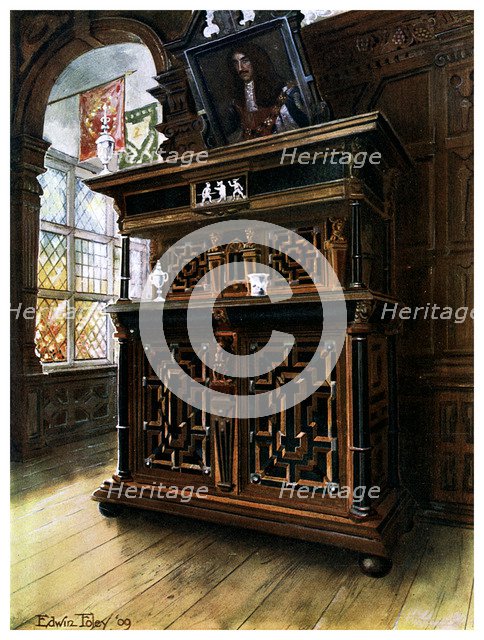 A cabinet of oak and walnut, 1910.Artist: Edwin Foley