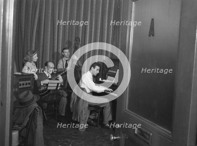 Portrait of Helen Carr, Sammy Herman, Joe Bianco, and Donn Trenner, Nola's, N.Y., ca. Feb. 1947. Creator: William Paul Gottlieb.