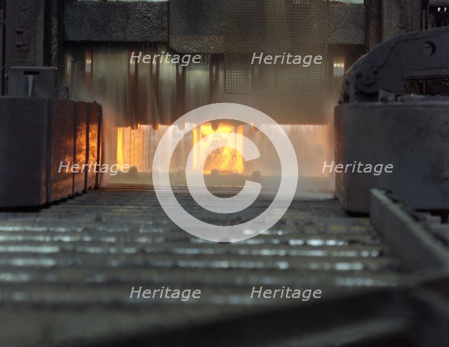 An ingot in a bloom mill, Park Gate Iron and Steel Company, Rotherham, South Yorkshire, 1966. Artist: Michael Walters