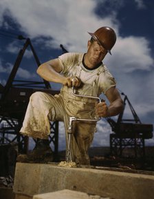 Carpenter at work on Douglas Dam, Tennessee (TVA), 1942. Creator: Alfred T Palmer.