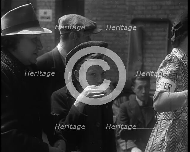 Dutch Refugees Having Tea at a Reception Centre in the United Kingdom, 1940. Creator: British Pathe Ltd.