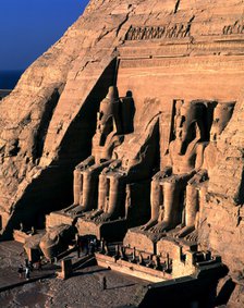 Façade of the Great Temple of Ramses II at Abu Simbel. It has four seated colossi of Ramses II an…