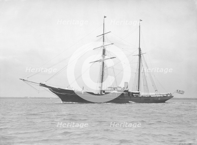 The auxiliary schooner 'Xarifa' at anchor, 1912. Creator: Kirk & Sons of Cowes.