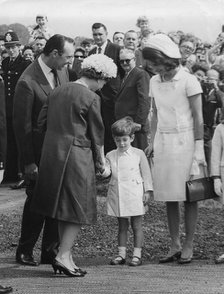 The Queen shaking hands with young John Kennedy, Runnymede, near Windsor, Berkshire, 1965. Artist: Unknown