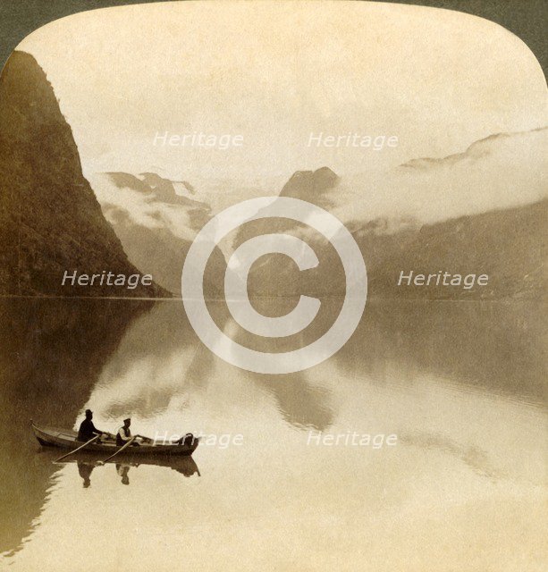'On sombre Lake Olden, between cloud-covered mountains, to Maelkevold glacier, Norway', 1905. Creator: Unknown.