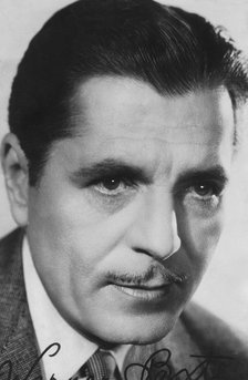 Warner Baxter, (1889-1951), American actor, c1930s-c1940s. Signed photograph. Artist: Unknown