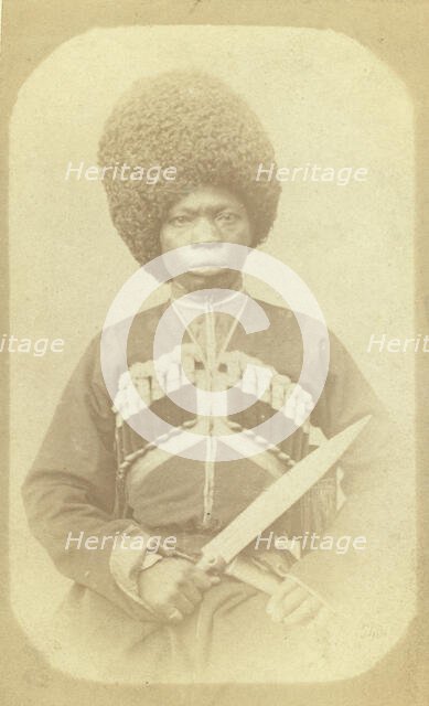 Three-quarter length portrait of man, seated, facing front, between 1870 and 1886. Creator: George Kennan.