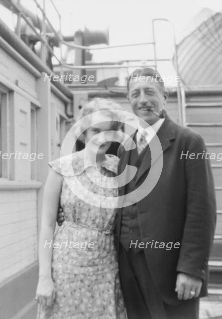 Von Lueckner, Felix, Count, and Countess, standing outdoors, 1931 June 5. Creator: Arnold Genthe.