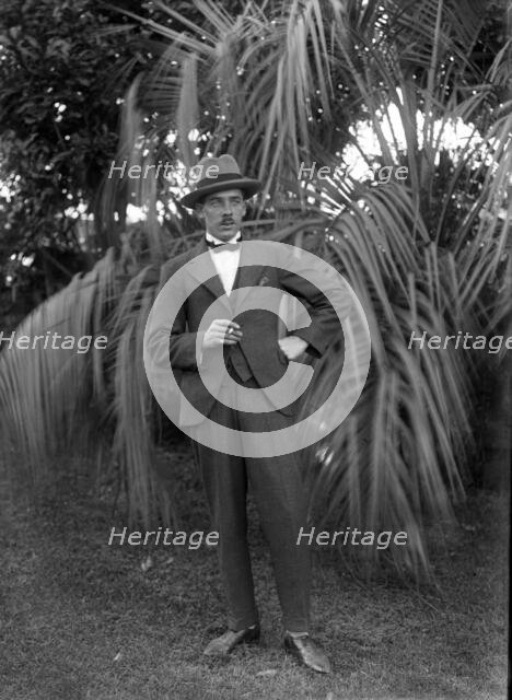 Photos and life story of John Henderson L'Estrange (1864-1913) standing and William Manderville Elli Creator: Robert Augustus Henry L'Estrange.