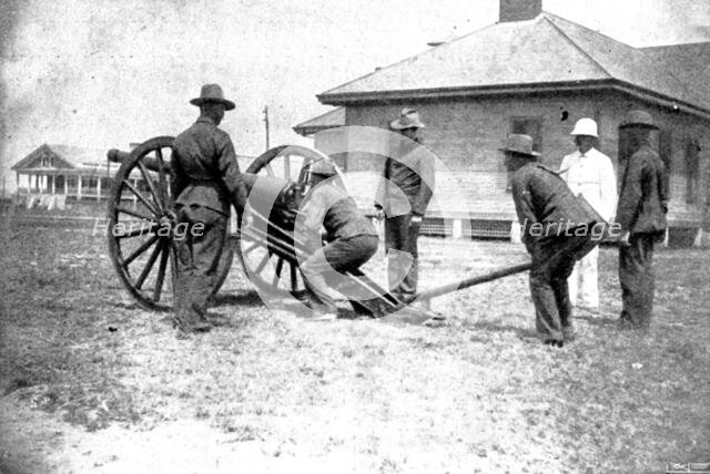 The Spanish-American War: American naval and military types - sighting gun for action, 1898. Creator: Unknown.