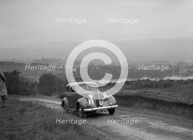 Ford V8 saloon competing in the South Wales Auto Club Welsh Rally, 1937 Artist: Bill Brunell.