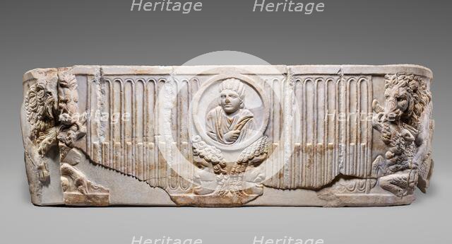 Front of a Sarcophagus with Female Portrait in a Medallion above Two Theatrical Masks...250-275. Creator: Unknown.