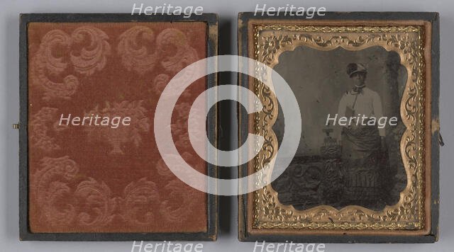 Tintype of a woman wearing a white hat and holding a book, 1880s. Creator: Unknown.