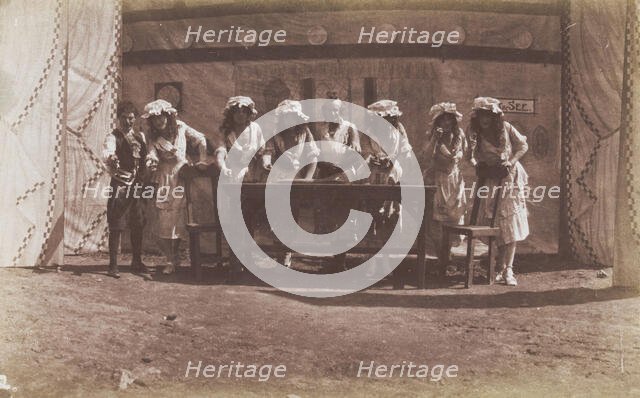 British servicemen in drag acting out a cooking class, 1918. Creator: Unknown.