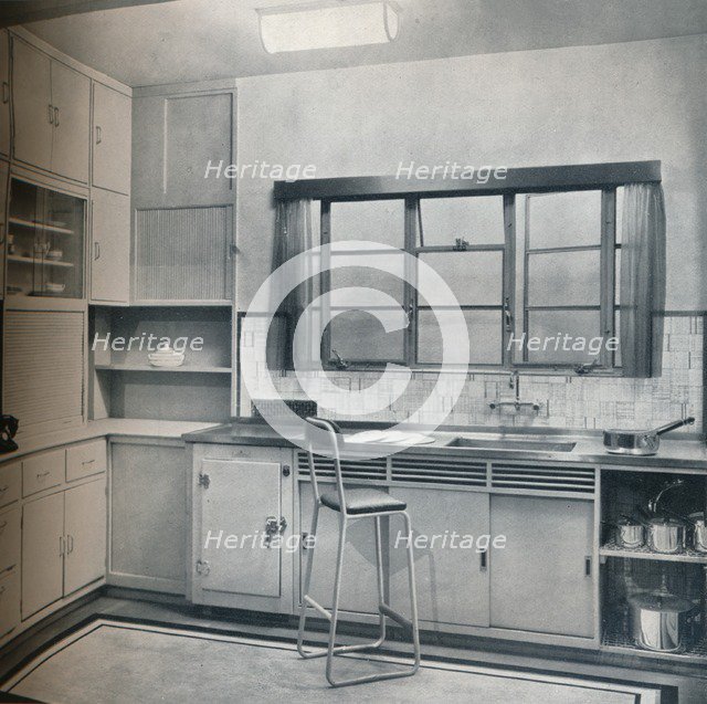 Section of a small kitchen, designed by Mrs Darcy Braddell, 1935.  Artist: Unknown.