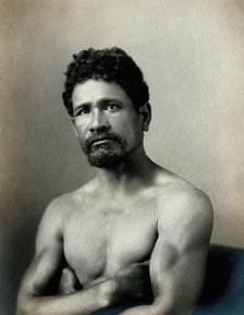 A barechested, bearded Samoan man, with his arms crossed, c1900. Creator: Unknown.