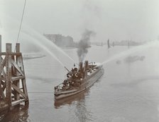 The 'Beta' fire float with hoses, River Thames, London, 1910. Artist: Unknown.