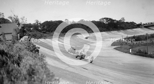 Earl Howe's Delage GP leading ER Hall's Bentley at the BARC Meeting, Brooklands, 25 May 1931. Artist: Bill Brunell.
