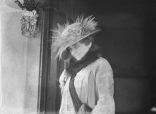 Slater, Mrs., standing by the door of a house in Long Beach, 1924 July. Creator: Arnold Genthe.