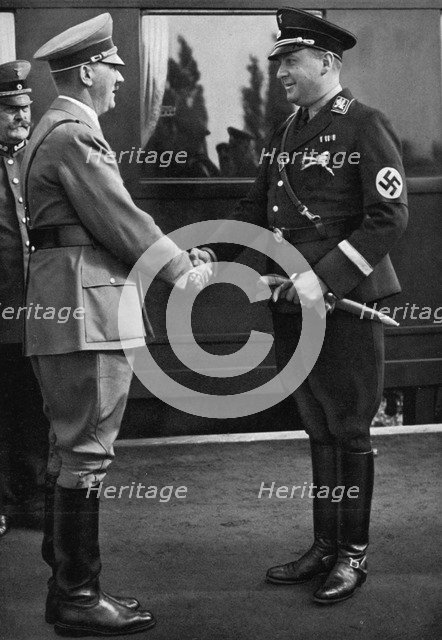 Minister Darré greets the Führer during Erntedankfestes (Harvest Festival), 1936. Artist: Unknown