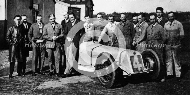 Robert Benoist with a cigarette, leaning against a Delage 15-S8, 1927. Artist: Unknown