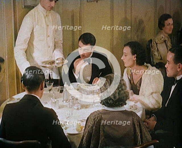 Upper Class People Enjoying a Meal in a Restaurant, 1931. Creator: British Pathe Ltd.
