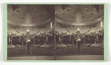 Untitled [auditorium decorated with US flags], late 19th century. Creator: Wright & Hartwell.