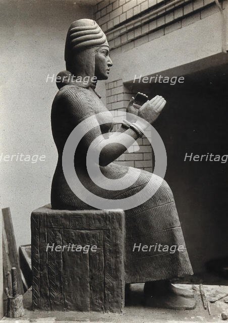 A sculpture of Gula, Mesopotamian deity of healing, with a dog at her side, c1900. Creator: Unknown.