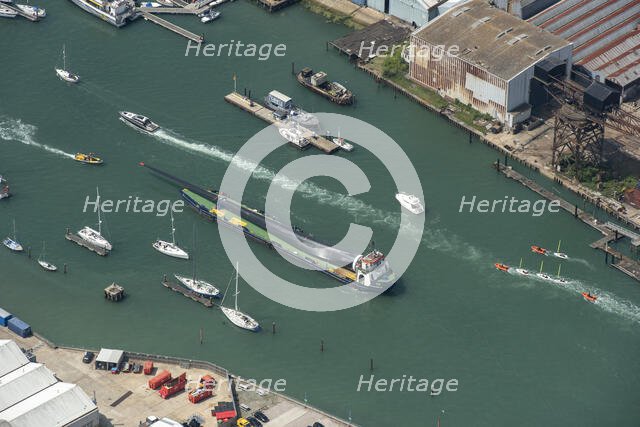A wind turbine blade aboard a barge, on the River Medina, Cowes, Isle of Wight, 2021 Creator: Damian Grady.