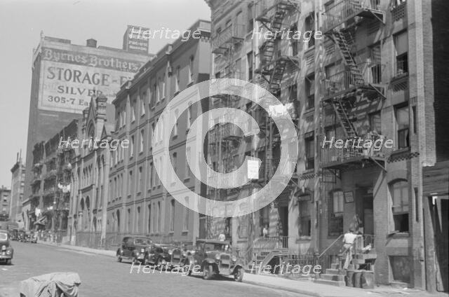 House fronts, 61st Street between 1st and 3rd Avenues, New York, 1938. Creator: Walker Evans.