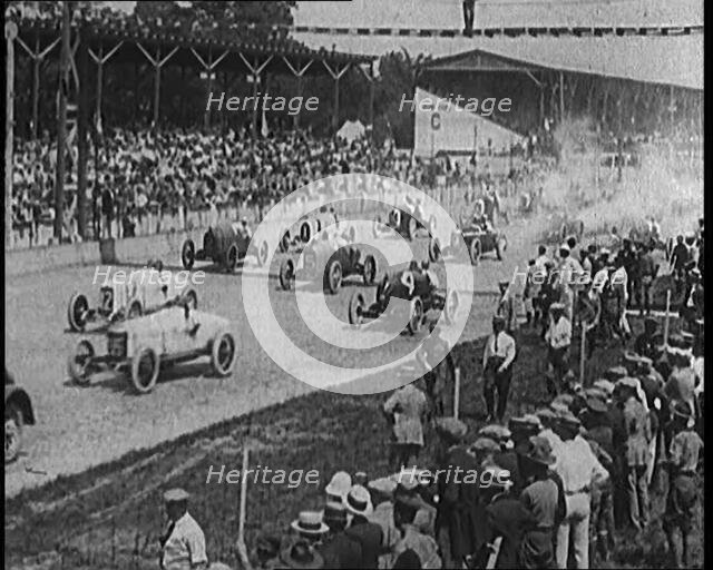 Racing Cars at the Start of a Race in Front of a Large Crowd, 1920. Creator: British Pathe Ltd.