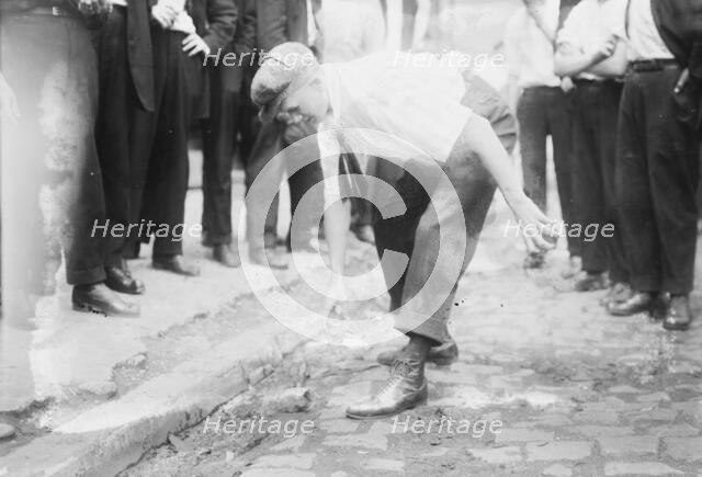 Bayonne picking up stones, between c1910 and c1915. Creator: Bain News Service.