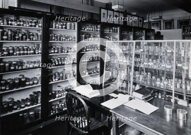 The Wellcome Building, Euston Road, London: working area in the materia medica stores, c1930s.. Creator: Unknown.