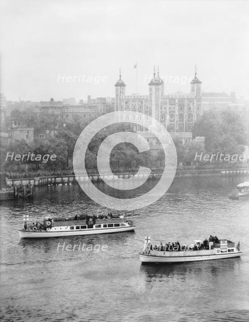 Boats passing along the Thames in front of the Tower of London, c1955. Creator: Arthur Charles Kirby Ware.